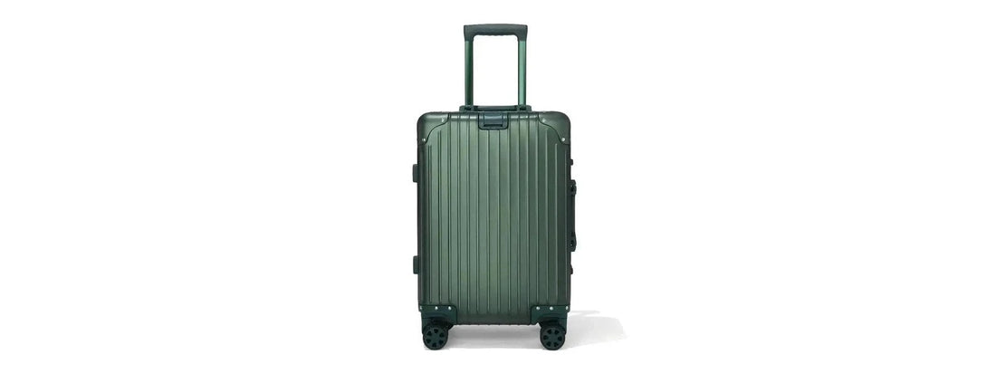 Premium aluminum suitcase in airport terminal with business traveler