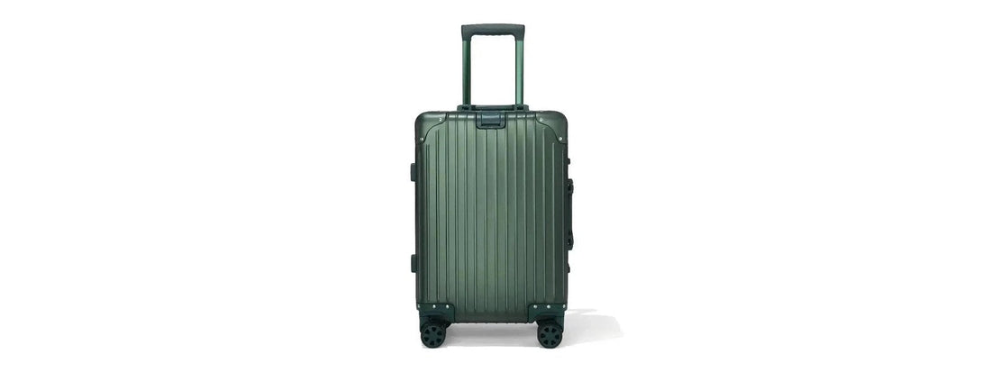 24 inch aluminum suitcase in airport terminal