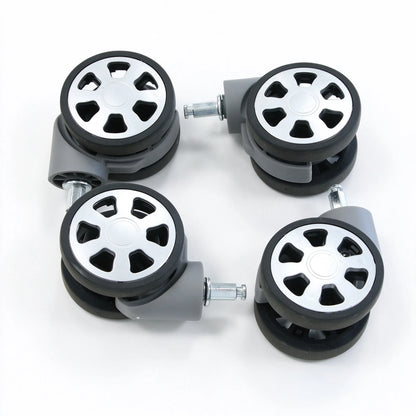 Dual replacement suitcase caster wheels with 360 degree swivel housing and metal insert stem, shown from an angle